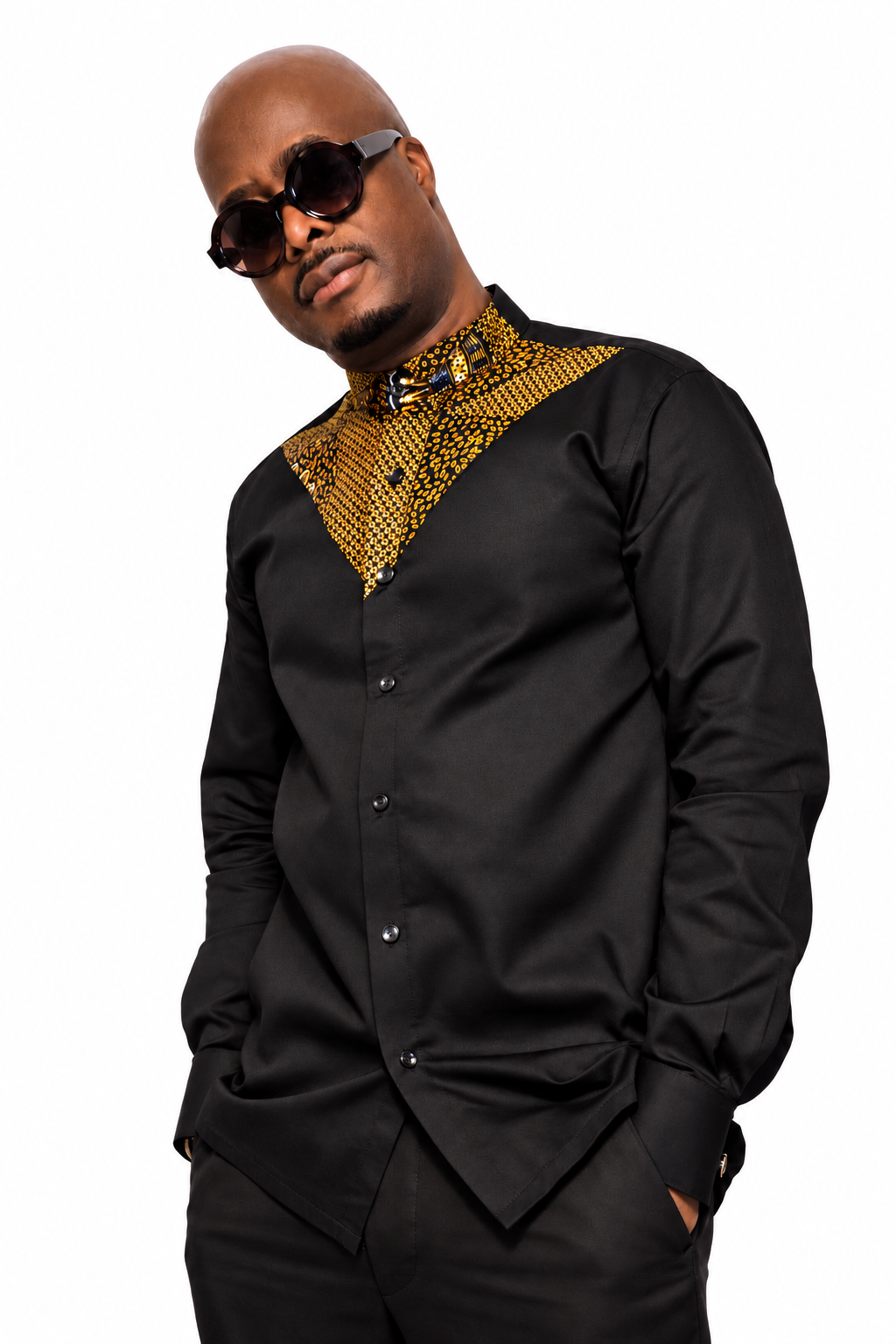 Akin African print shirt styled on model, angled view on white background.