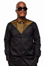 Akin black chino shirt with gold and navy Ankara V-shaped panel, front view on white background.