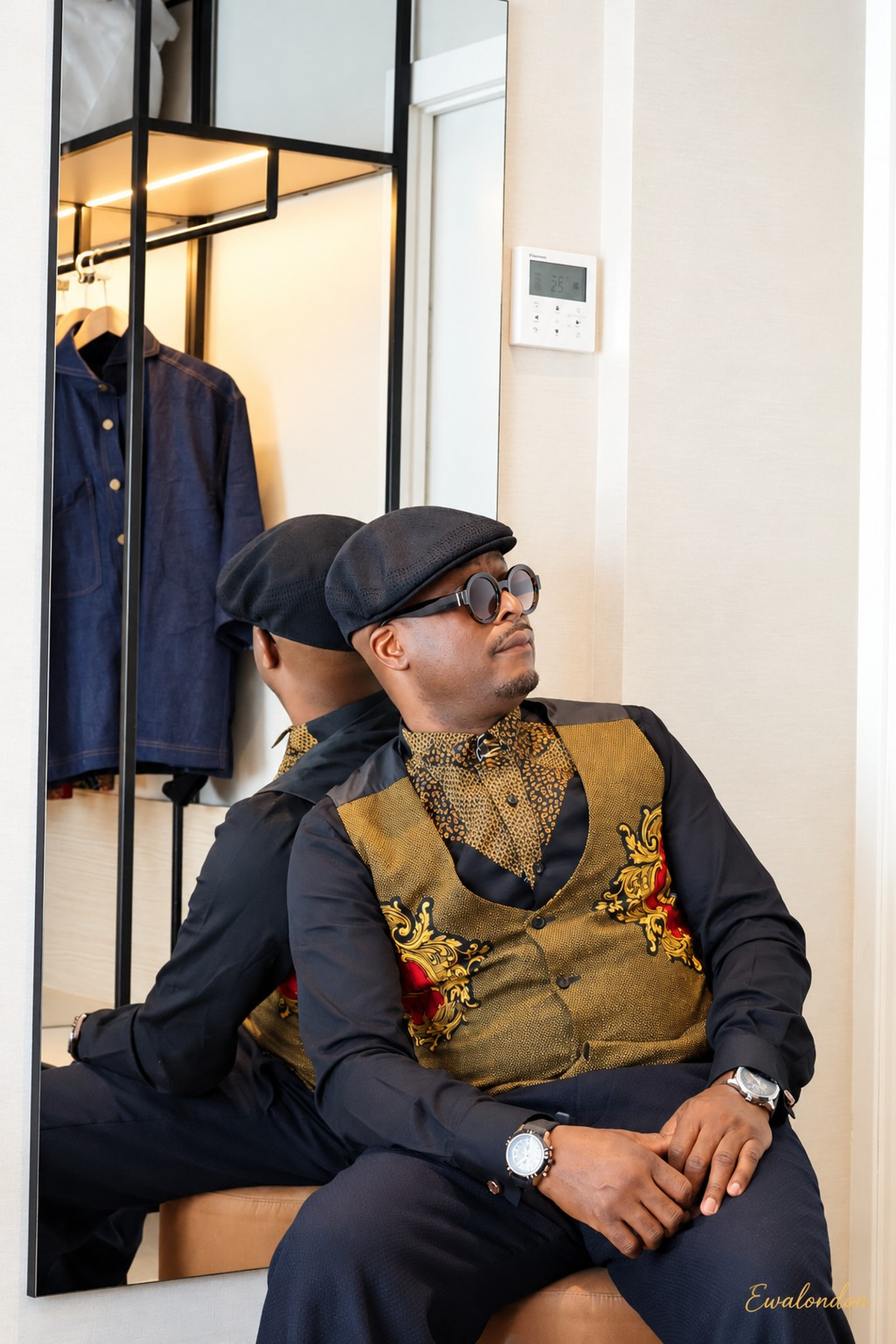 Ankara Print Waistcoat — original seated model photograph with mirror reflection